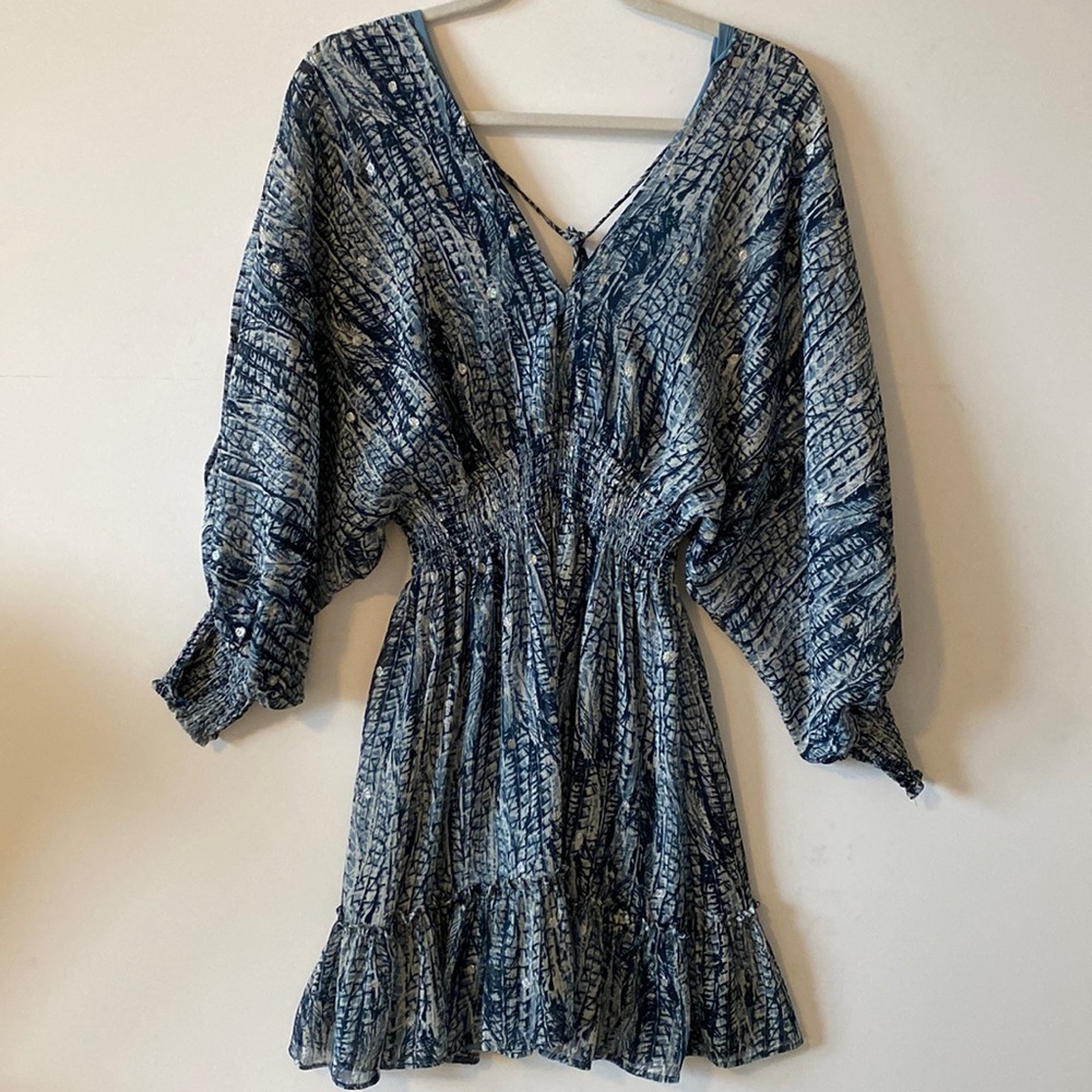 Beautiful dress with slit sleeves and open v back with tassles